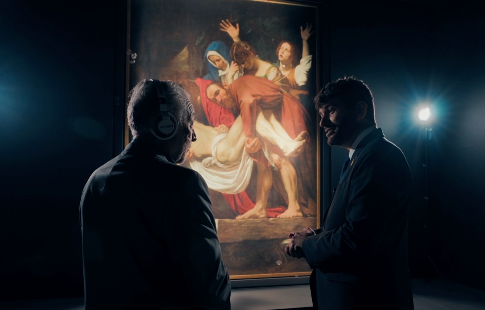 Vito Mabrucco, NTT Brand Evangelist, and Stefano Riccardi, Holy See Pavilion Director at Expo 2025, looking at Caravaggio’s masterpiece The Deposition